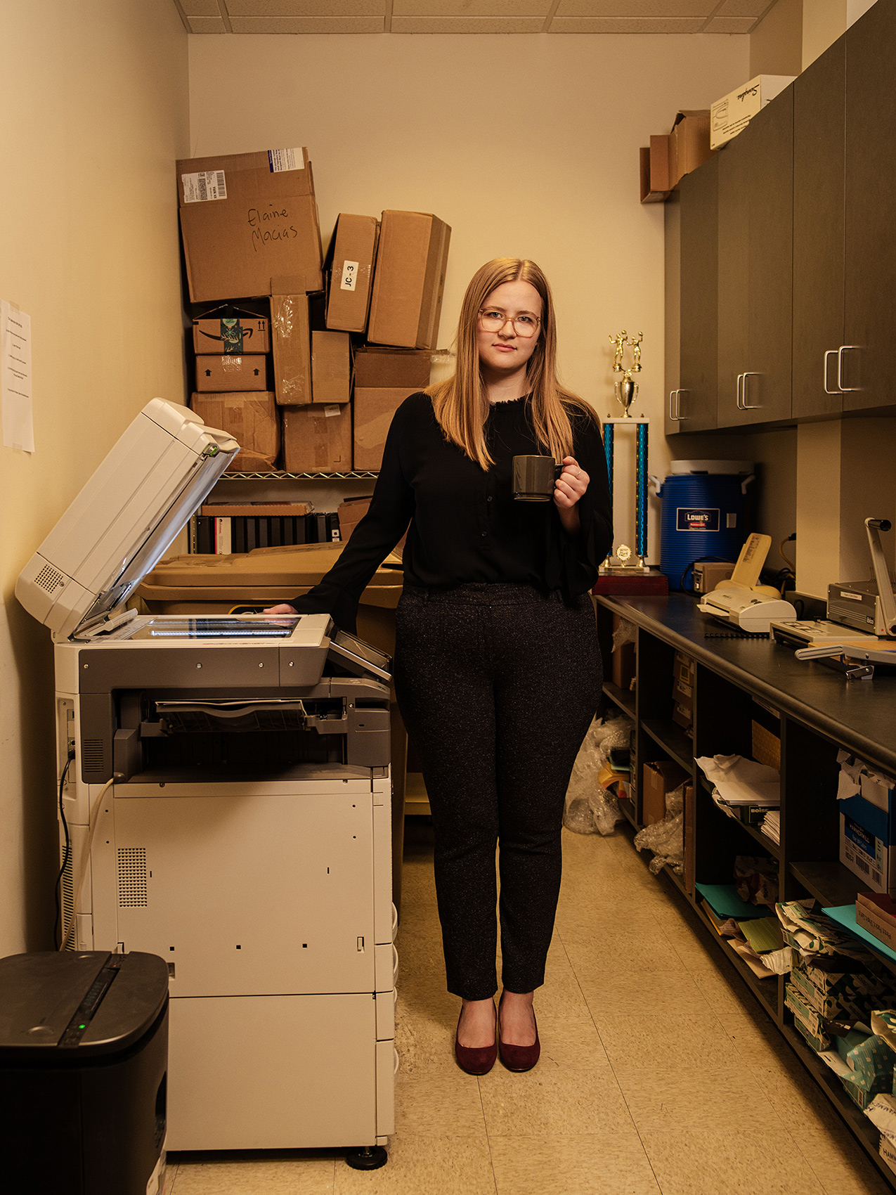 A conceptual and narrative portrait of a college graduate joining the workforce photographed by humor and portrait photographer Josh Huskin in Texas.