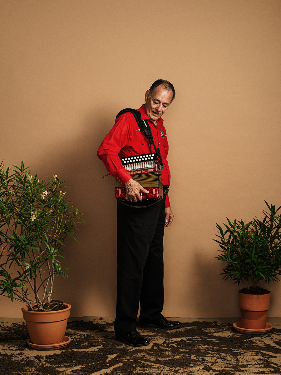 San Antonio musician, Santiago Jimenez Jr poses for a photograph in San Antonio, TX by portrait photographer Josh Huskin